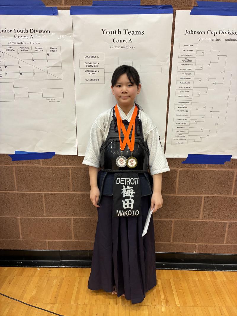 Image of Makoto Umeda with medals Johnson Cup Tournament