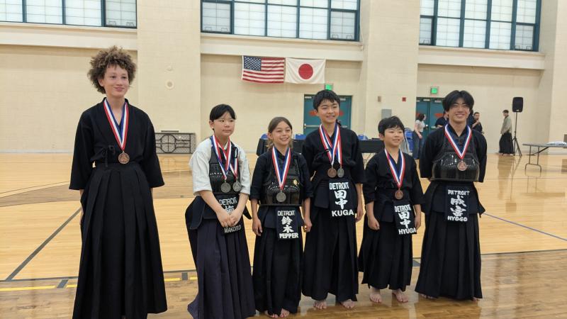 Image of DKD youth members with their medals from the MWKF Tournament