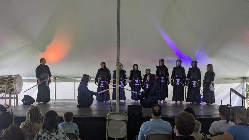 Image of the beginning of a demo with two members bowing in sonkyo stance
